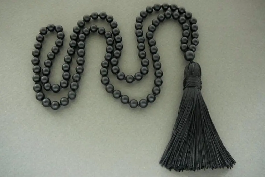 black bead necklace meaning